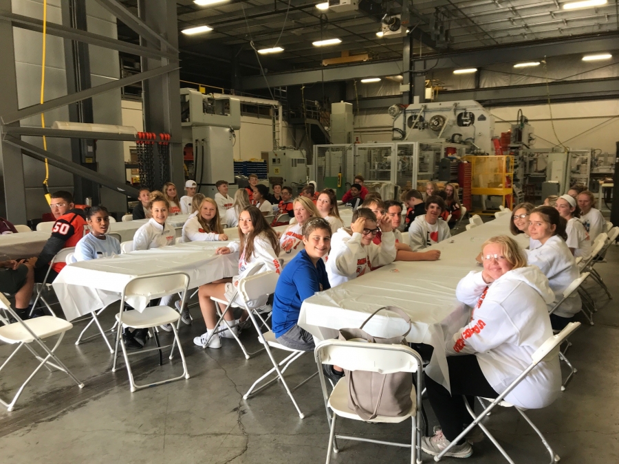 kids at tables with white table clothes